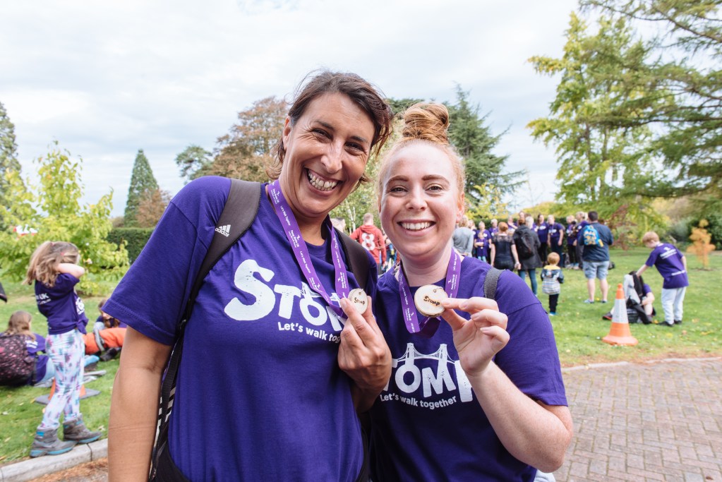 A photo of two women who have completed the Stomp fundraising trek
