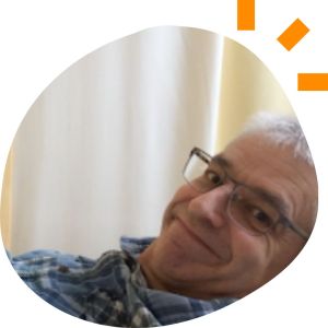Philip, a 63-year-old white man wearing glasses.