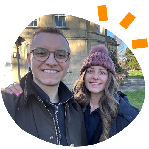 Photo of Youssef and Dalia standing in front of the Penny Brohn UK National Centre.