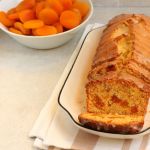 A plate with a loaf of apricot cake on