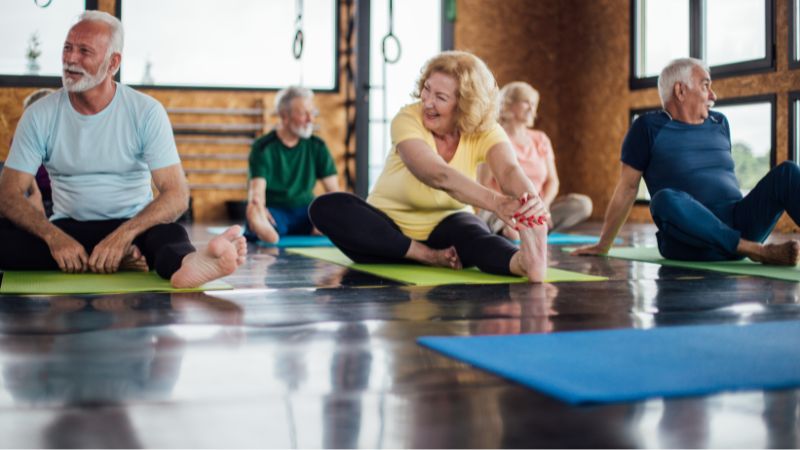 A group of people in a yoga class