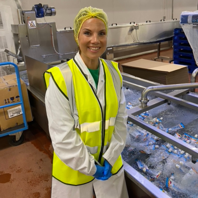A picture of Amy at a factory